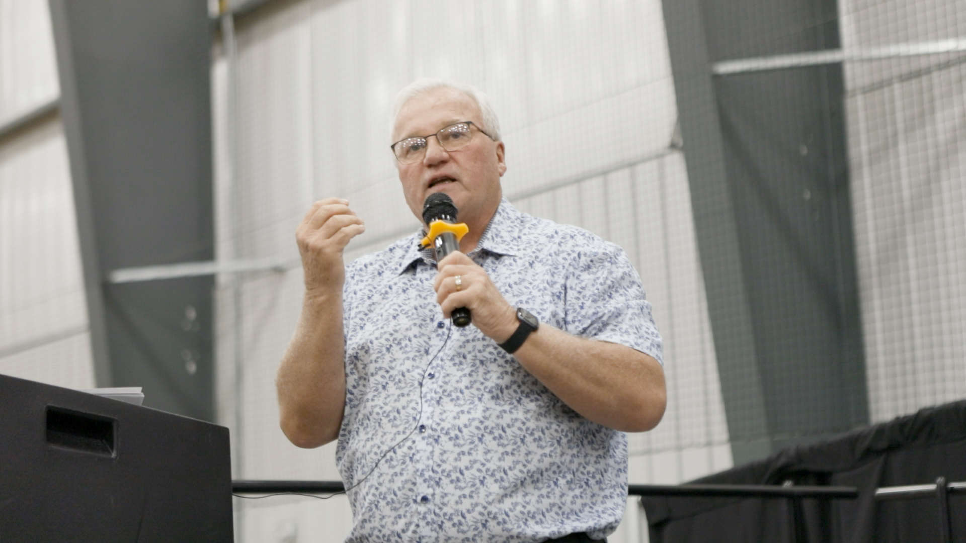 Brooks Mayor John Petrie delivers a speech on stage during the launch of the Somali Community Empowerment Association.