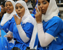 Somali girls wearing traditional Somali flag dresses at Heritage Week celebration in Brooks