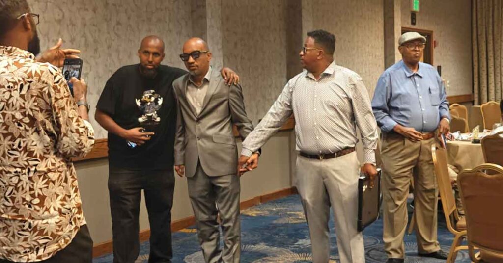 Abdulkadir Hussein Mayow Buunis with the member of the community.